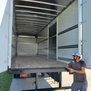 mover at country club moving sitting outside a recently-emptied moving truck