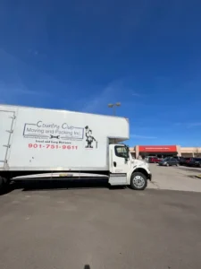 country club moving truck parked in a parking lot