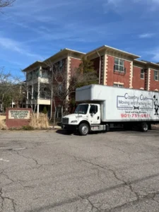 country club moving truck outside an apartment complex