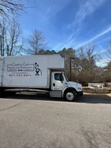 country club moving truck parked in a parking lot
